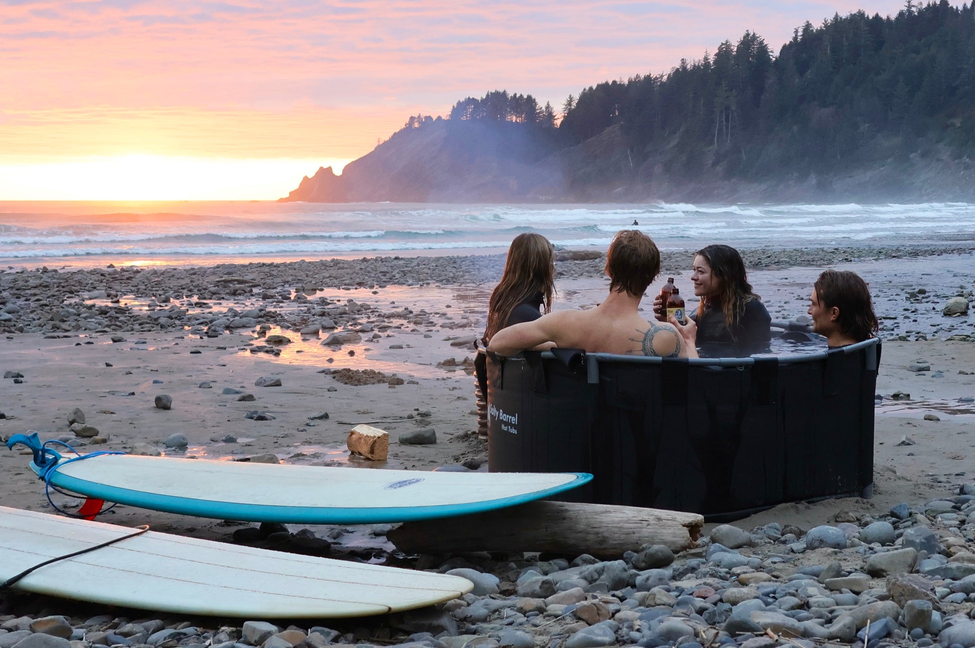 Surfers in hot tub on the beach